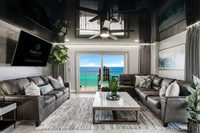 a living room with a couch and a table at The Summit 1001 in Panama City Beach