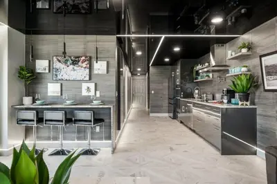 a kitchen with a counter and stools in it at The Summit 1001 in Panama City Beach