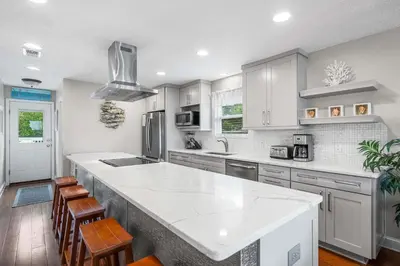a kitchen with white cabinets and a white counter top at Serenity - Inlet Beach in Inlet Beach