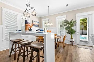 a kitchen and dining room with a table and chairs at Sea Power in Santa Rosa Beach