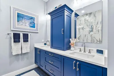 a bathroom with a blue cabinet and a sink at Sea Power in Santa Rosa Beach