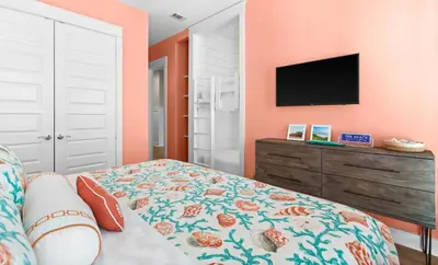 a bedroom with a bed and a flat screen tv at Sea Power in Santa Rosa Beach