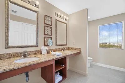 a bathroom with two sinks and a toilet at 607-E-Splash in Panama City Beach