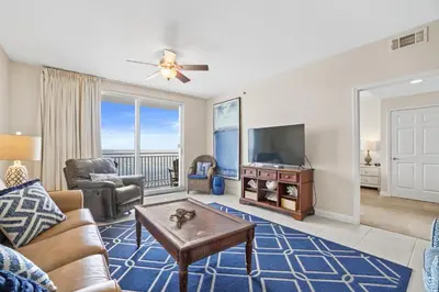 a living room with a couch and a tv at 607-E-Splash in Panama City Beach