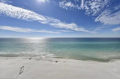 a view of a beach with the ocean and sky at 804-Tidewater in Panama City Beach