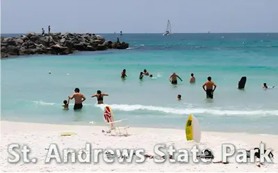 a group of people in the water at the beach at Sea Breeze House- 3 bd 2 ba 5 min walk to beach in Panama City Beach