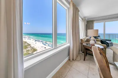 a living room with a view of the beach at Grandview East 1201 in Panama City Beach