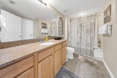 a bathroom with a sink and a toilet and a shower at Grandview East 1201 in Panama City Beach
