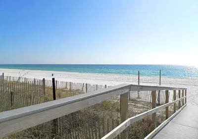 a wooden boardwalk leading to a beach with the ocean at Grandview East 1201 in Panama City Beach