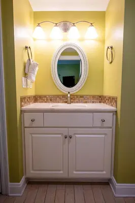 a bathroom with a white sink and a mirror at Treasure Island 1910 in Panama City Beach