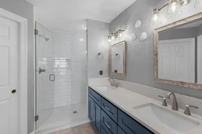 a bathroom with two sinks and a shower at Treasure Island 0505 in Panama City Beach
