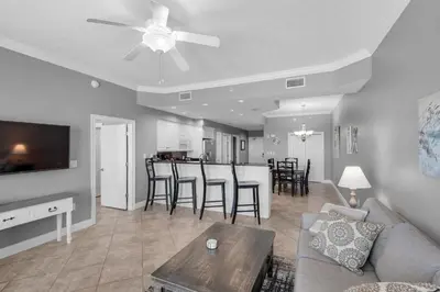 a living room with a couch and a table at Treasure Island 0505 in Panama City Beach