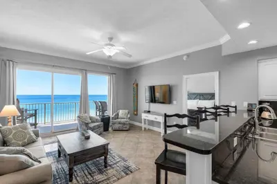 a living room with a view of the ocean at Treasure Island 0505 in Panama City Beach