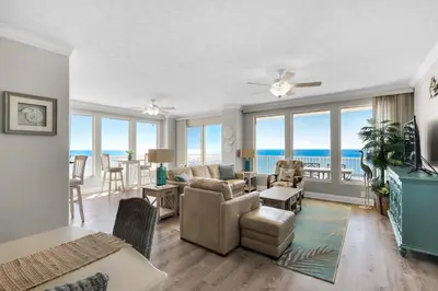 a living room with a view of the ocean at Treasure Island 0801 in Panama City Beach