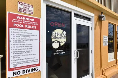 a sign on the door of a restaurant with a no driving sign at Treasure Island 0801 in Panama City Beach