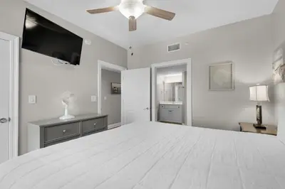 a large white bedroom with a large bed at Treasure Island 0801 in Panama City Beach