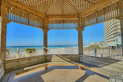 a wooden pavilion with a view of the beach at Treasure Island 1706 in Panama City Beach