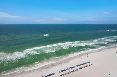 an overhead view of a beach with people and the ocean at Treasure Island 1806 in Panama City Beach