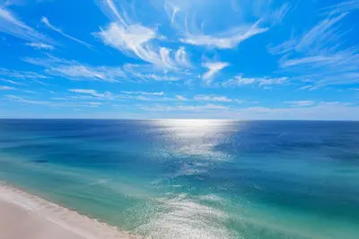 an overhead view of a beach with the ocean at Treasure Island 1911 in Panama City Beach
