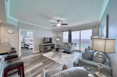 a living room with a view of the ocean at Treasure Island 1510 in Panama City Beach