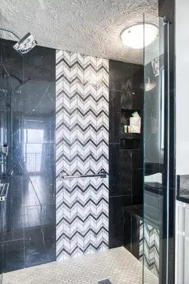 a bathroom with a shower with a glass door at Treasure Island 1811 in Panama City Beach
