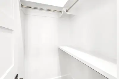 a white staircase in a room with white walls at New-Walk To Beach - Private Heated Pool in Inlet Beach