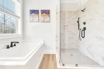 a white bathroom with a tub and a shower at New-Walk To Beach - Private Heated Pool in Inlet Beach