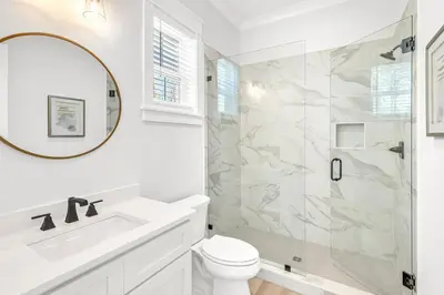 a bathroom with a shower and a toilet and a sink at New-Walk To Beach - Private Heated Pool in Inlet Beach