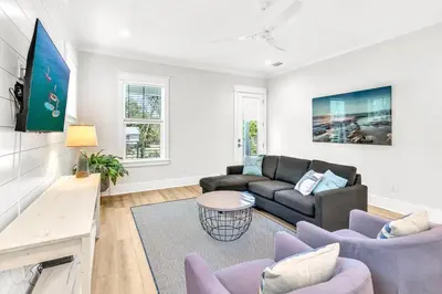 a living room with a couch and a table at New-Walk To Beach - Private Heated Pool in Inlet Beach