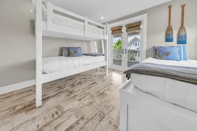 a bedroom with two bunk beds and a window at Town of Prominence- Just Beachy in Inlet Beach