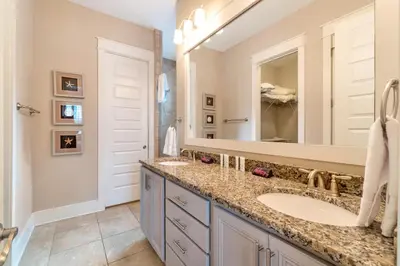 a bathroom with two sinks and a large mirror at Ta-Da! Luxury 2BR Townhome, Golf Cart & Pool Access in Santa Rosa Beach