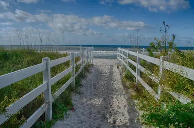 a path to the beach next to a fence at Casa Loma Panama City Beach - Beachfront in Panama City Beach
