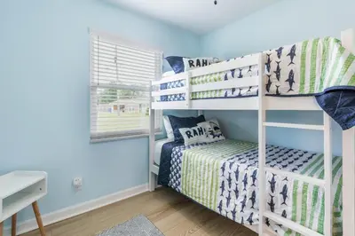 a bedroom with bunk beds in a room at Charming 3BR Home with Free Parking & Game Room in Panama City