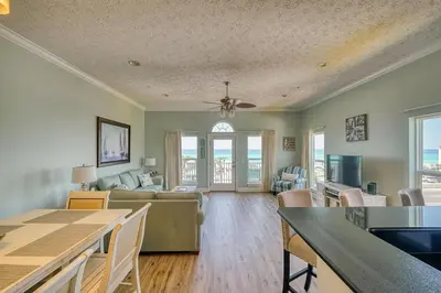 a living room with a couch and a table at Vista del Mar I Short Walk to the Beach 301 in Panama City Beach