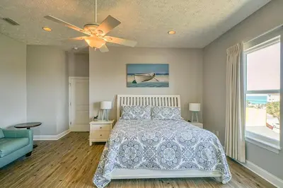 a bedroom with a bed and a ceiling fan at Vista del Mar I Short Walk to the Beach 301 in Panama City Beach