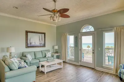 a living room with a couch and a ceiling fan at Vista del Mar I Short Walk to the Beach 301 in Panama City Beach