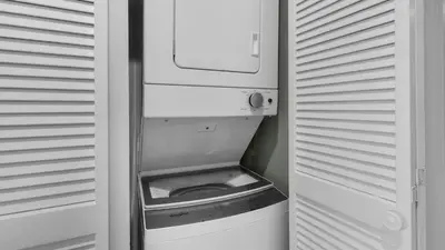 a refrigerator with its door open with a bowl in it at Eastern Shores 215 in Santa Rosa Beach