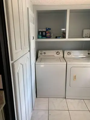 a laundry room with a washer and dryer at Double Wide Getaway in PCB in Panama City Beach