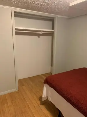 a room with a bedroom with a bed in it at Double Wide Getaway in PCB in Panama City Beach