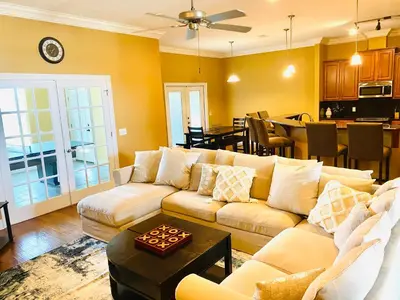 a living room with a couch and a table at Newly renovated modern, spacious & quiet location in Callaway