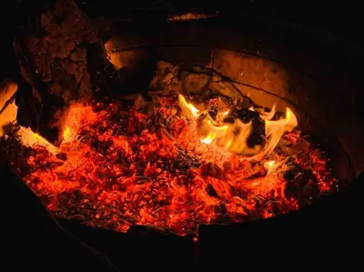 a fire pit with a bunch of food in it at Newly renovated modern, spacious & quiet location in Callaway