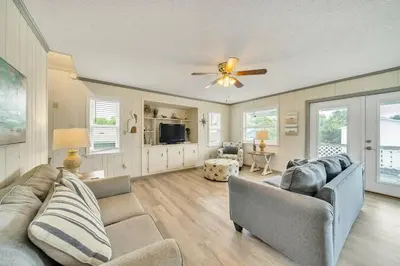 a living room with two couches and a ceiling fan at Nearby Beach l Friends & Family l Pet-Friendly in Panama City Beach