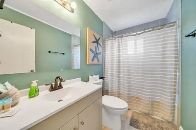 a bathroom with a sink and a toilet and a shower at Nearby Beach l Friends & Family l Pet-Friendly in Panama City Beach