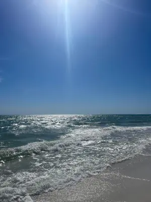 a view of the ocean from the beach at Dolphin's Den in Panama City Beach