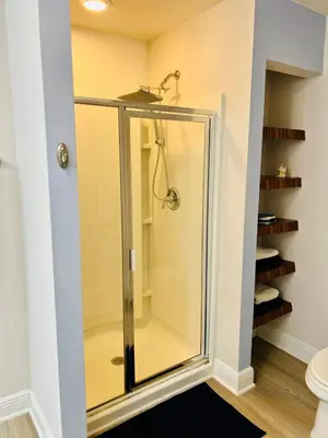 a glass shower in a bathroom next to a toilet at Close to beach, Pier Park, Game Room Theater Room in Panama City Beach