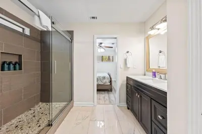 a bathroom with a shower and a sink at Beachcombers Nook, Firepit, yard, Sleeps 8, Walk to Beach in Panama City Beach