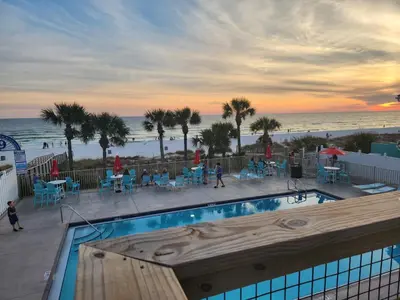 a swimming pool with a view of the beach at Gulf Highlands Beach Townhouse in Panama City Beach