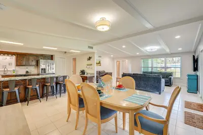a kitchen and living room with a table and chairs at Walk to Ocean Home in Panama City Beach! in Panama City Beach