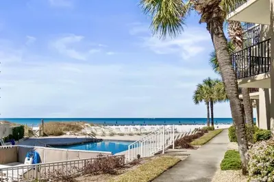 a resort with a swimming pool and the beach at Pelican Walk 101 in Panama City Beach