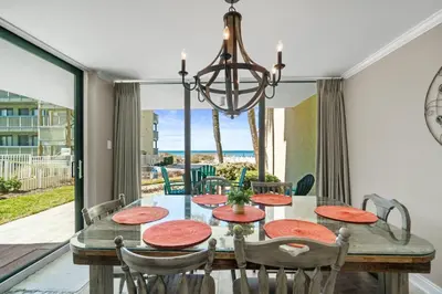 a dining room with a table and chairs at Pelican Walk 101 in Panama City Beach